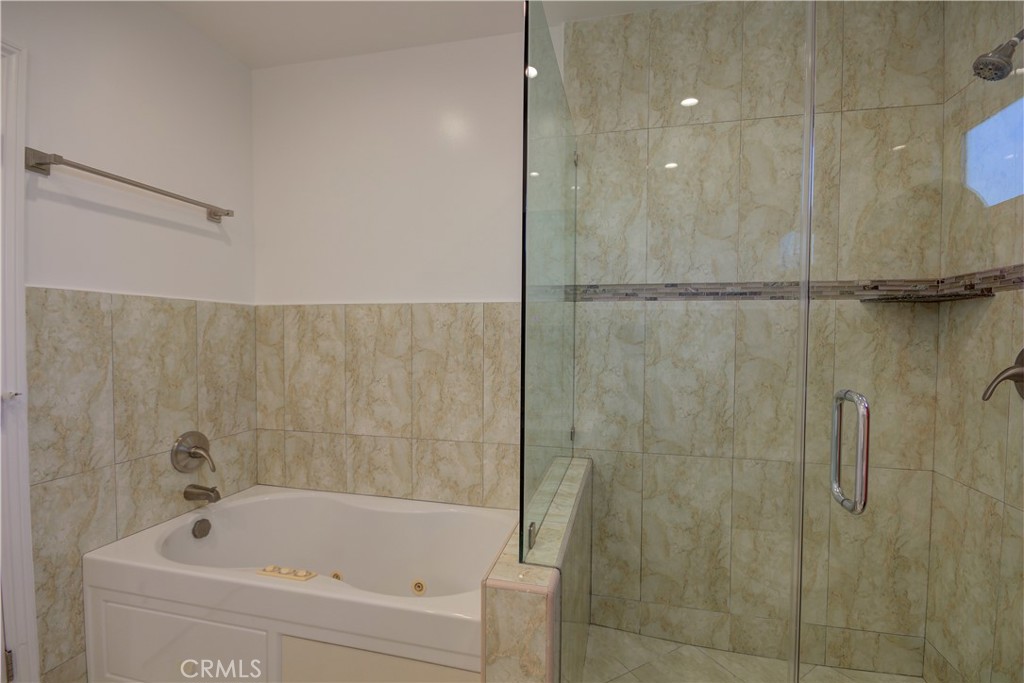 1367 East Windsor Road Glendale, CA 91205 - Photo 11 of 21 a bathroom with a bathtub and a shower