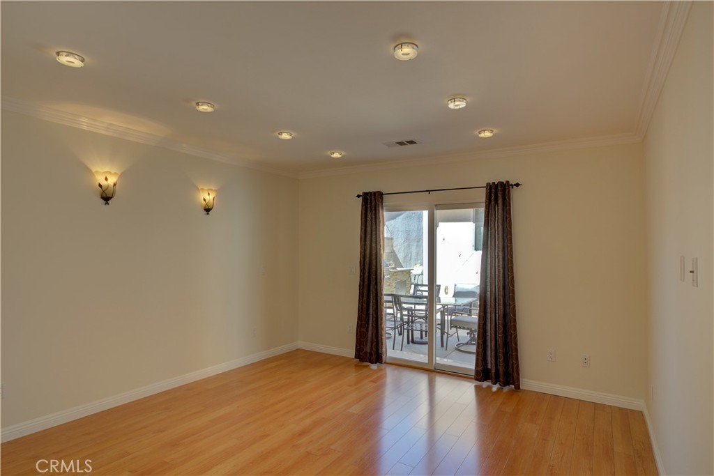 1367 East Windsor Road Glendale, CA 91205 - Photo 8 of 21 a view of an empty room with wooden floor and a window