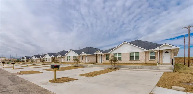 a front view of a house with street