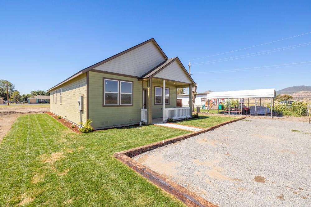 330 North Elm Street Merrill, OR 97633 - Photo 3 of 23 a view of an house with backyard and swimming pool