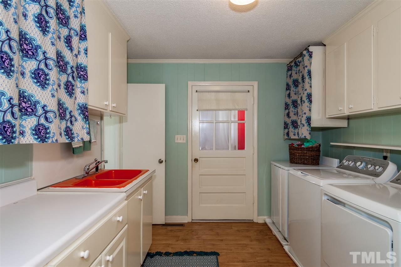 9409 Sauls Road Raleigh, NC 27603 - Photo 8 of 25 a room with storage and utility