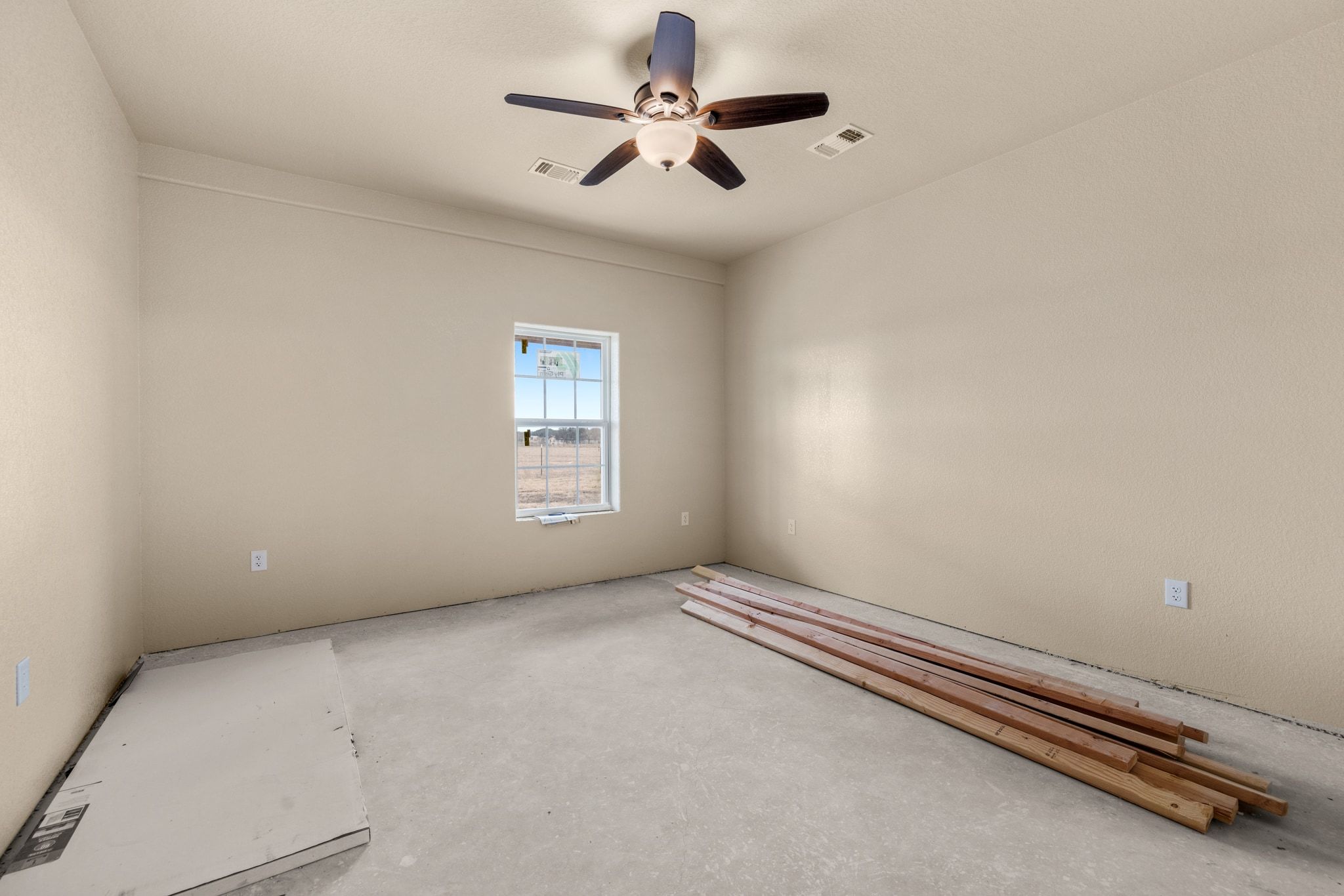 710 County Road 226 Florence, TX 76527 - Photo 7 of 22 wooden floor in an empty room with a window