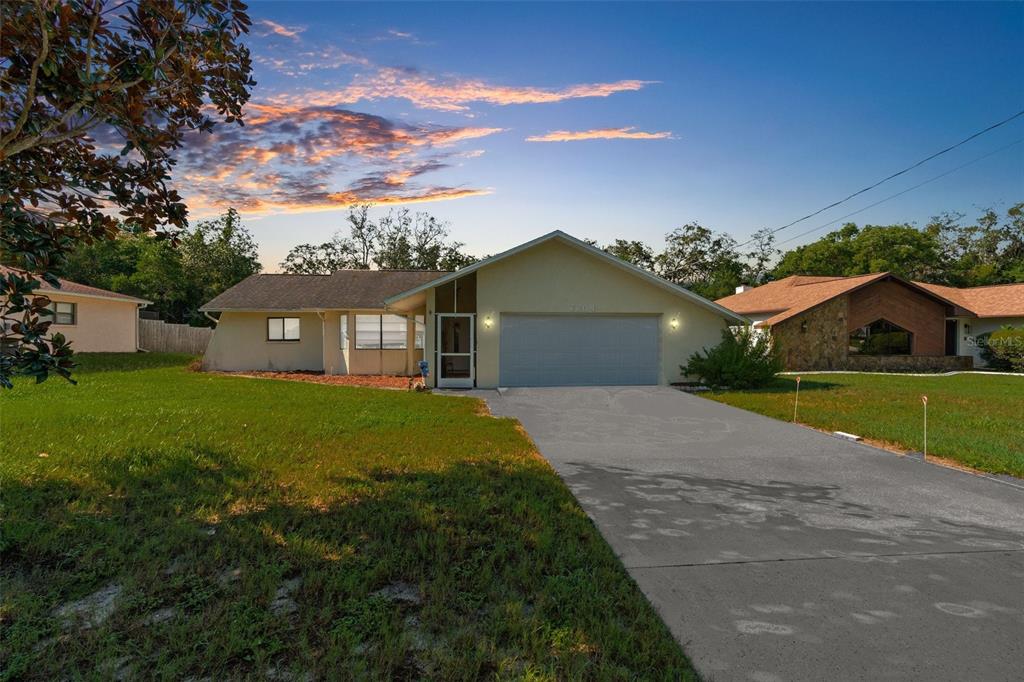 7264 Lindhurst Street Spring Hill, FL 34606 - Photo 1 of 1 a house view with a garden space
