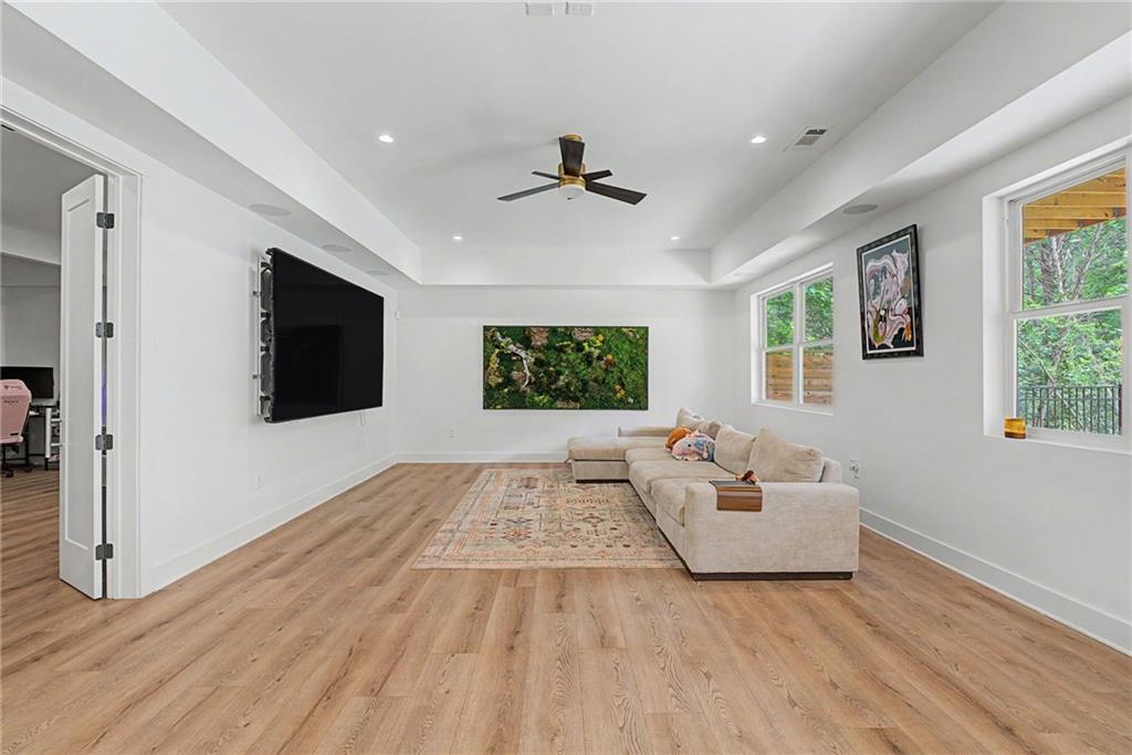 376 Hunnicut Road Southeast Mableton, GA 30126 - Photo 49 of 73 a living room with couches and a flat screen tv