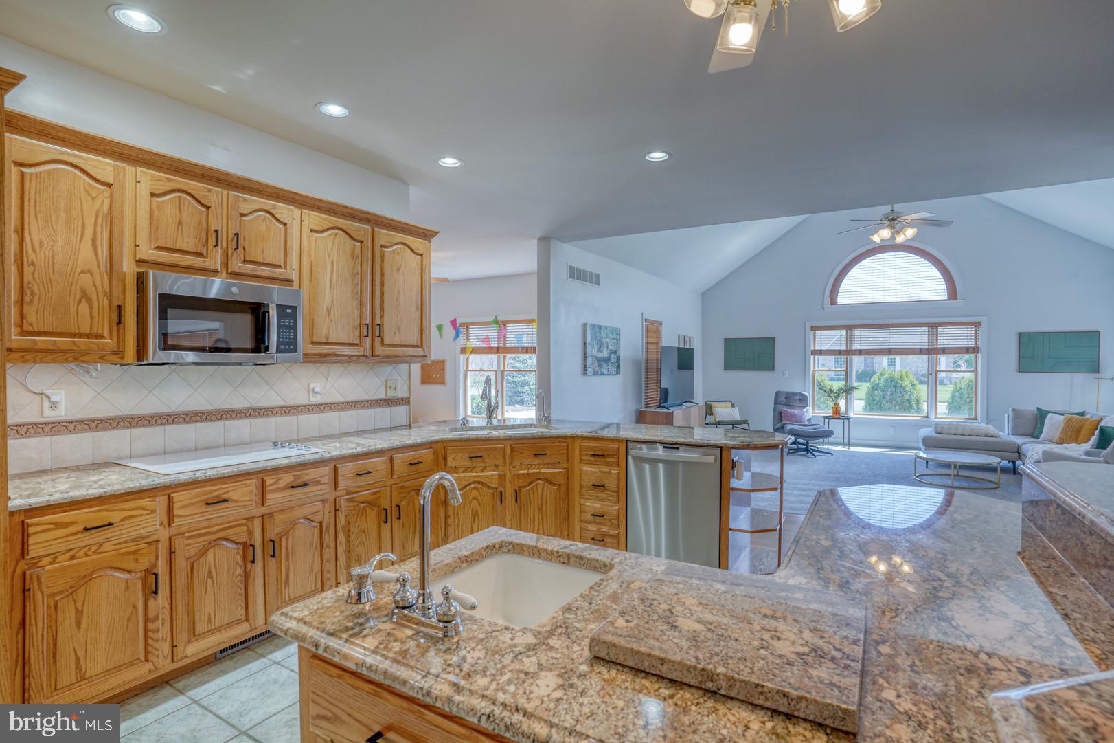 34 Chadwick Drive Dover, DE 19901 - Photo 33 of 59 a kitchen with stainless steel appliances granite countertop a sink stove and cabinets