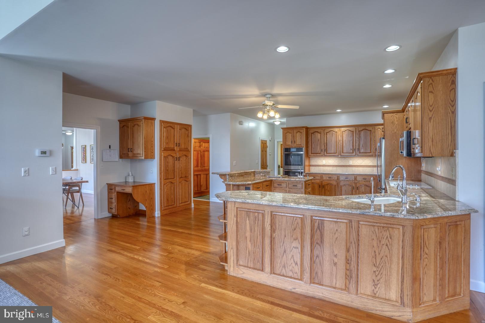 34 Chadwick Drive Dover, DE 19901 - Photo 37 of 59 a kitchen with stainless steel appliances granite countertop a refrigerator and a stove top oven