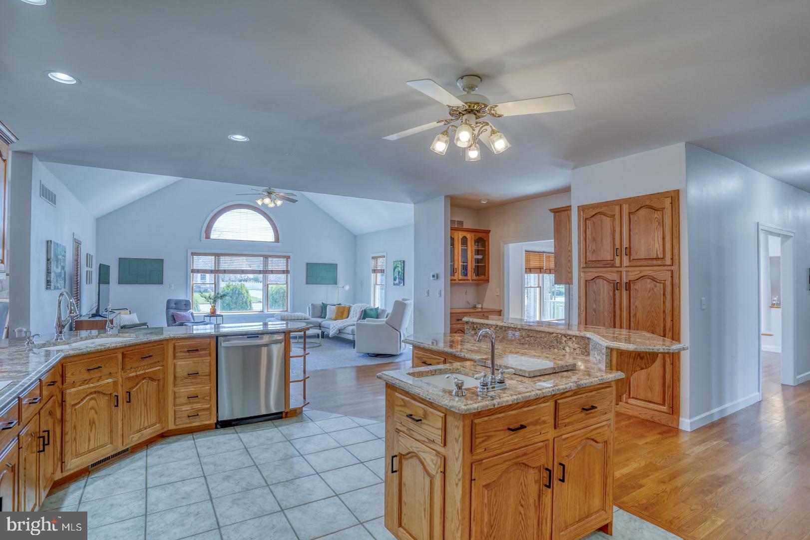 34 Chadwick Drive Dover, DE 19901 - Photo 38 of 59 a kitchen with granite countertop a sink stove and cabinets