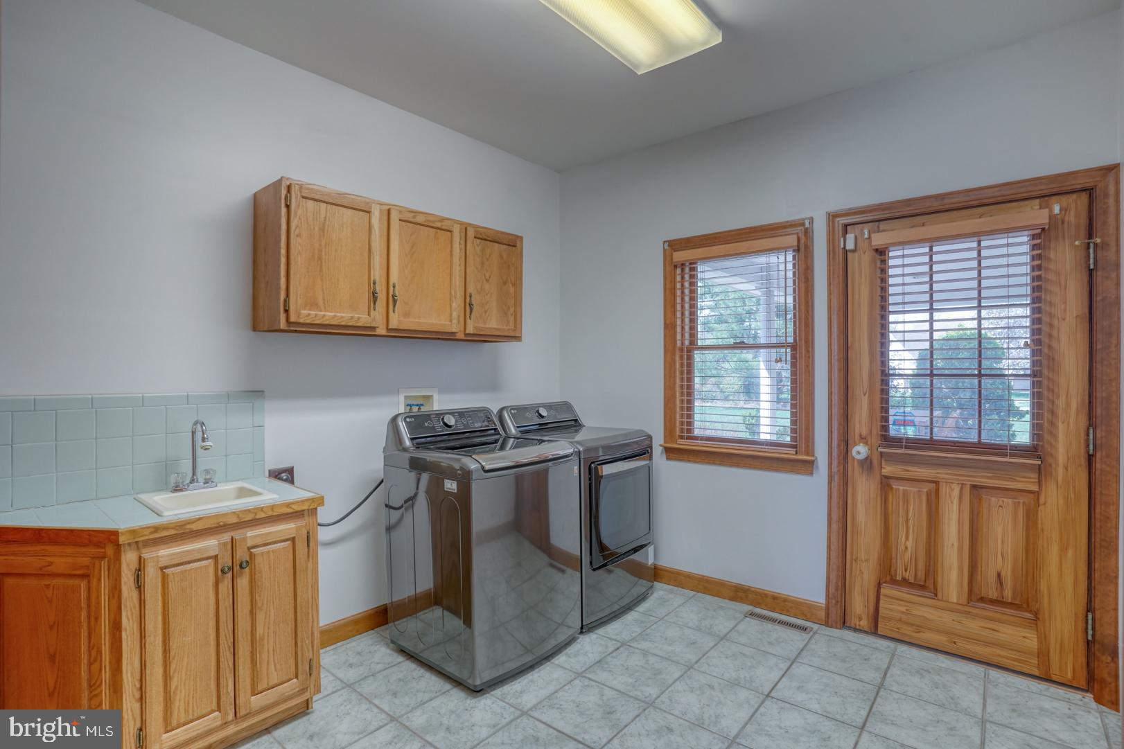 34 Chadwick Drive Dover, DE 19901 - Photo 40 of 59 a kitchen with stainless steel appliances granite countertop a stove a sink and a microwave