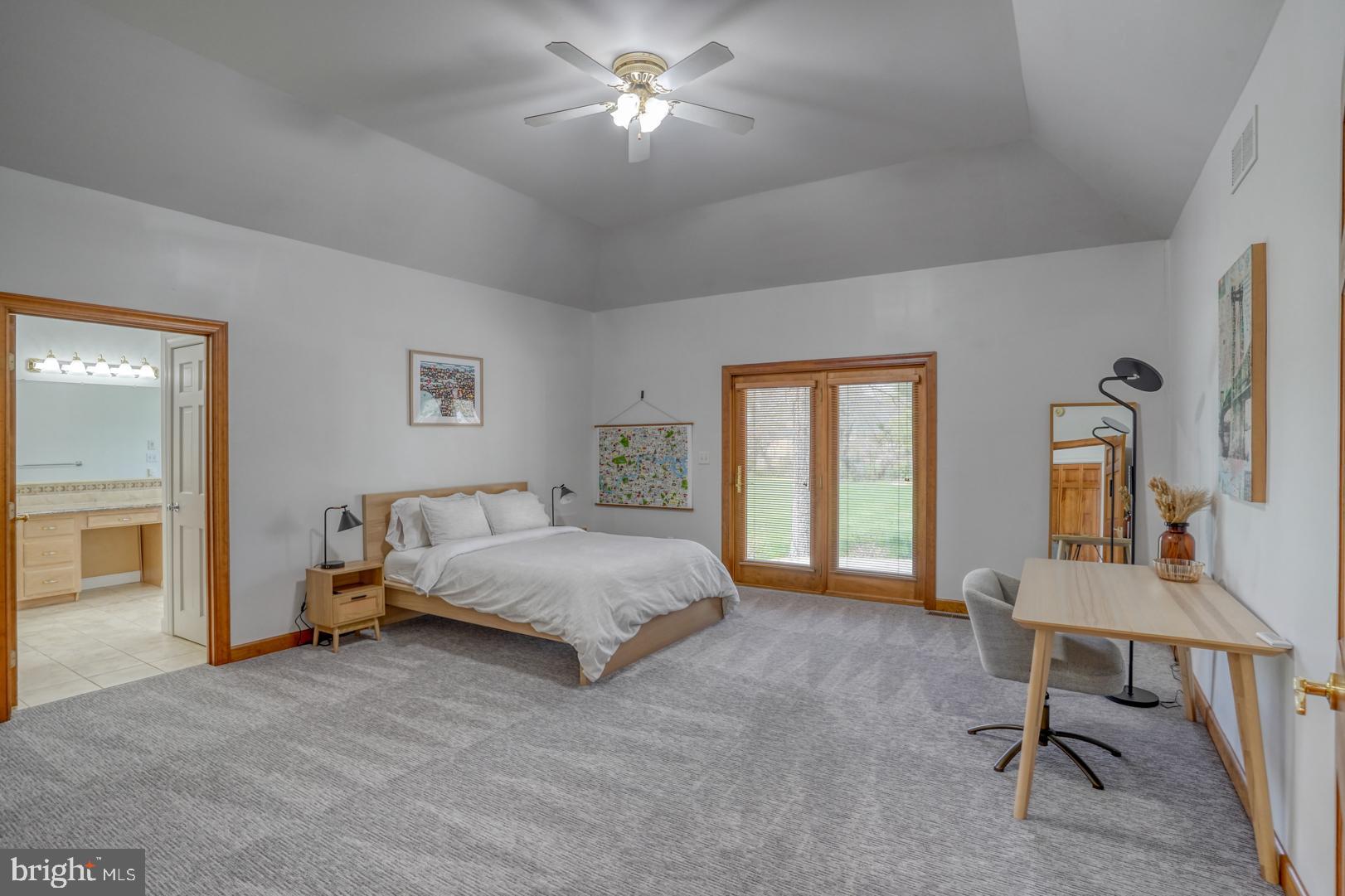 34 Chadwick Drive Dover, DE 19901 - Photo 42 of 59 a spacious bedroom with a bed and a chandelier