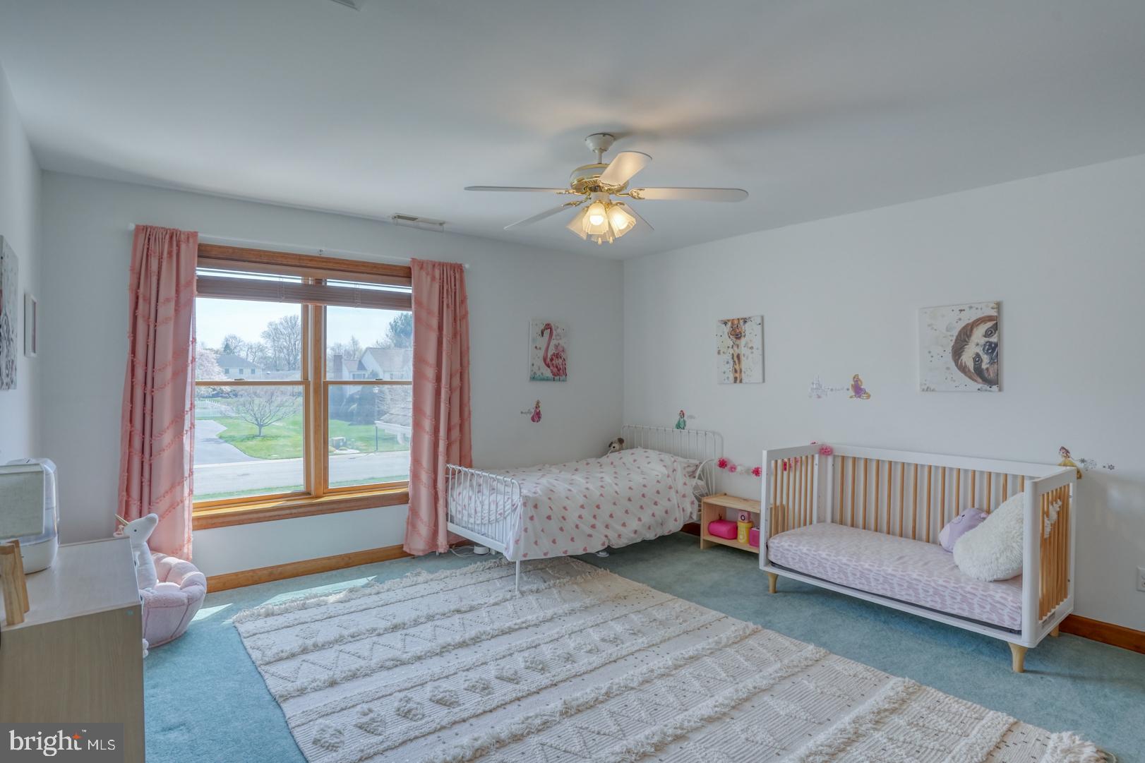 34 Chadwick Drive Dover, DE 19901 - Photo 48 of 59 a spacious bedroom with a bed and a couch