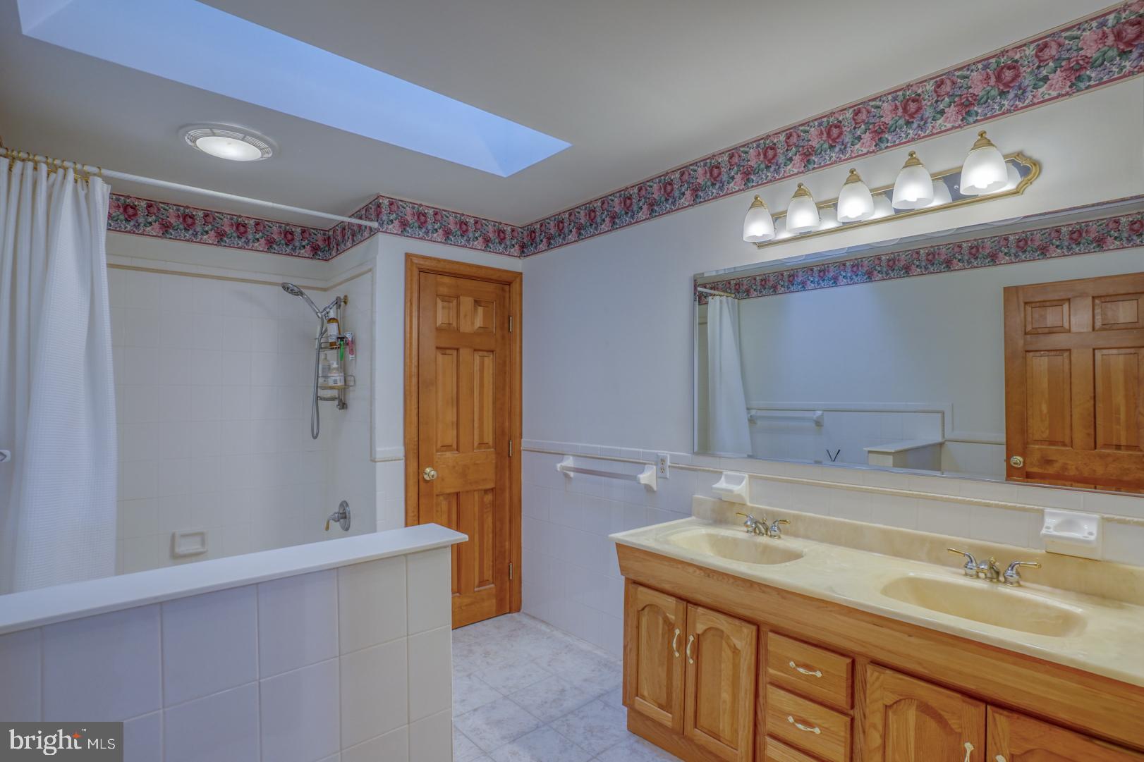34 Chadwick Drive Dover, DE 19901 - Photo 53 of 59 a bathroom with a sink and a mirror