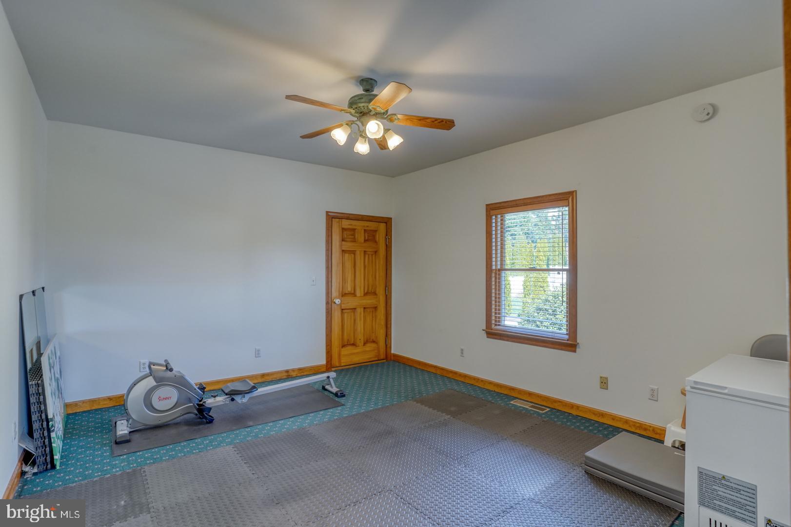 34 Chadwick Drive Dover, DE 19901 - Photo 56 of 59 a view of a room with gym equipment and a window