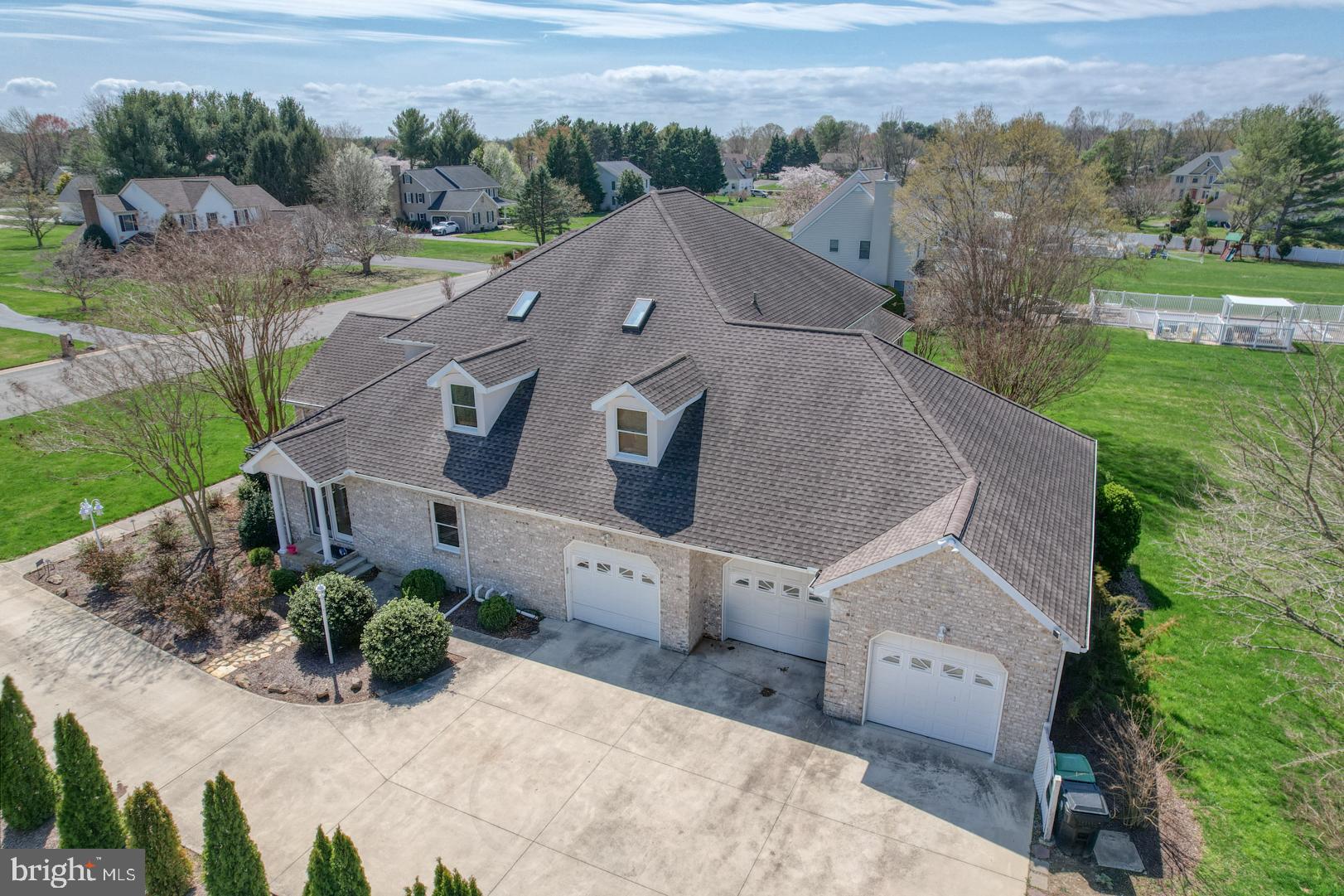 34 Chadwick Drive Dover, DE 19901 - Photo 7 of 59 an aerial view of a house with a yard and lake view