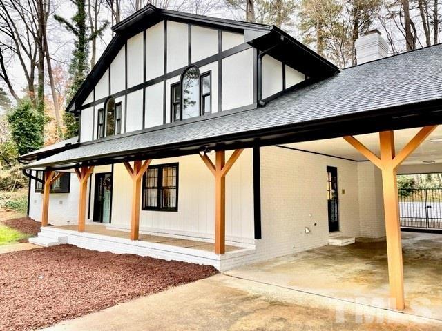 700 Lakestone Drive Raleigh, NC 27609 - Photo 1 of 35 a view of a house with a roof deck