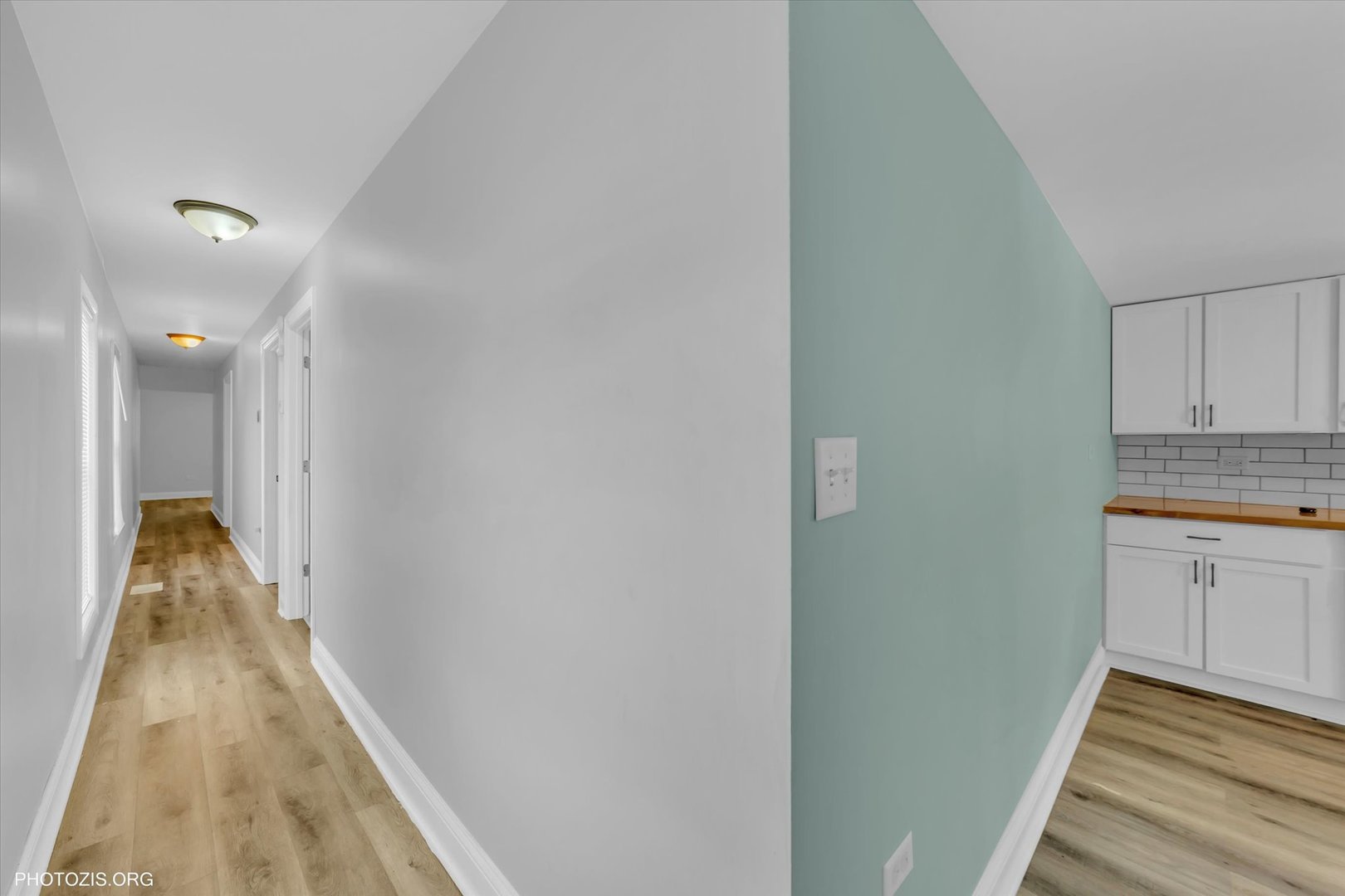 10004 South Torrence Avenue Chicago, IL 60617 - Photo 13 of 46 a view of hallway with wooden floor