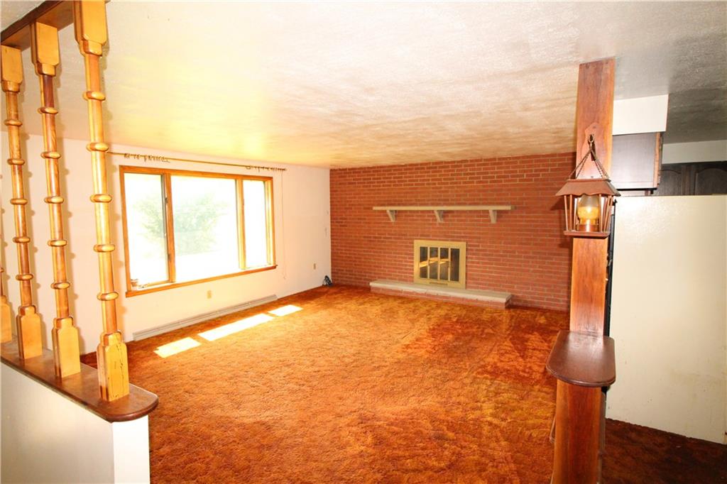 236 Brownlee Road Eighty Four, PA 15330 - Photo 2 of 25 Large 19x16 Living Room w/ Brick Wall highlighting Fireplace & Big Front Picture Window