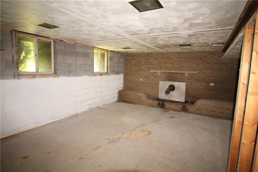 236 Brownlee Road Eighty Four, PA 15330 - Photo 12 of 25 Big 19x17 Game Room w/ Finished Ceiling & Studs ready to be completed offering a Brick Wall housing exhaust for future Wood Burner