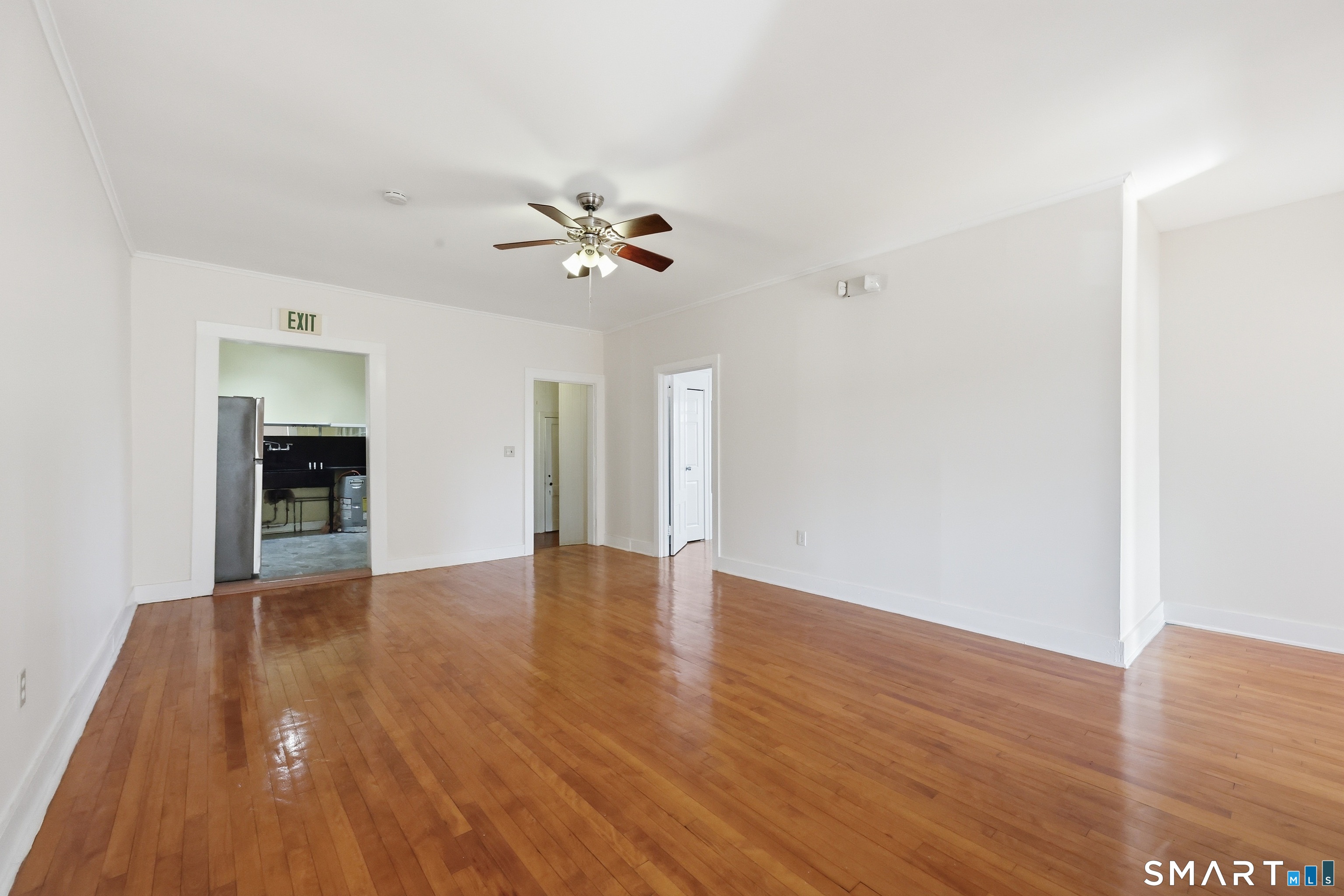360 Main Street, Unit 3B Middletown, CT 06457 - Photo 4 of 21 a view of an empty room with wooden floor
