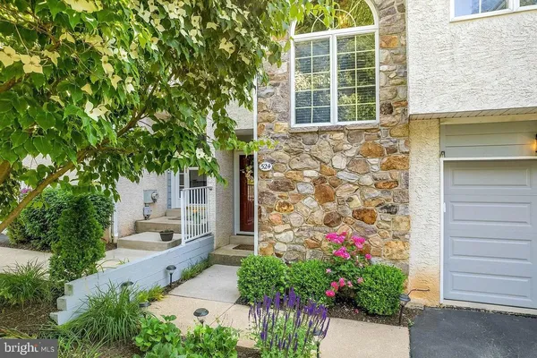 a flower plants in front of a house
