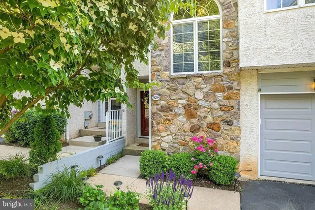 a flower plants in front of a house