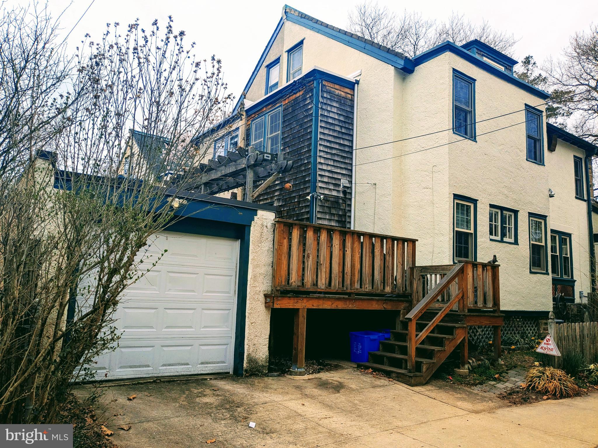 304 Wellesley Road Philadelphia, PA 19119 - Photo 33 of 34 Rear view with garage and steps to deck