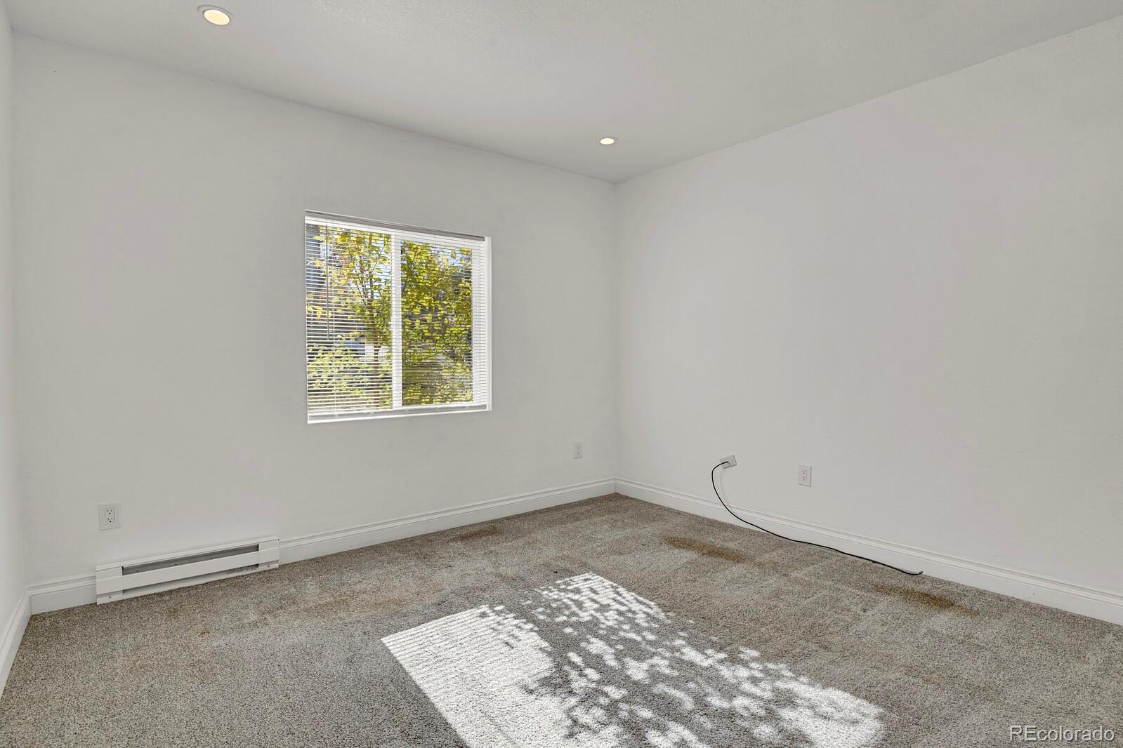 3720 Miller Street Wheat Ridge, CO 80033 - Photo 13 of 17 an empty room with a window