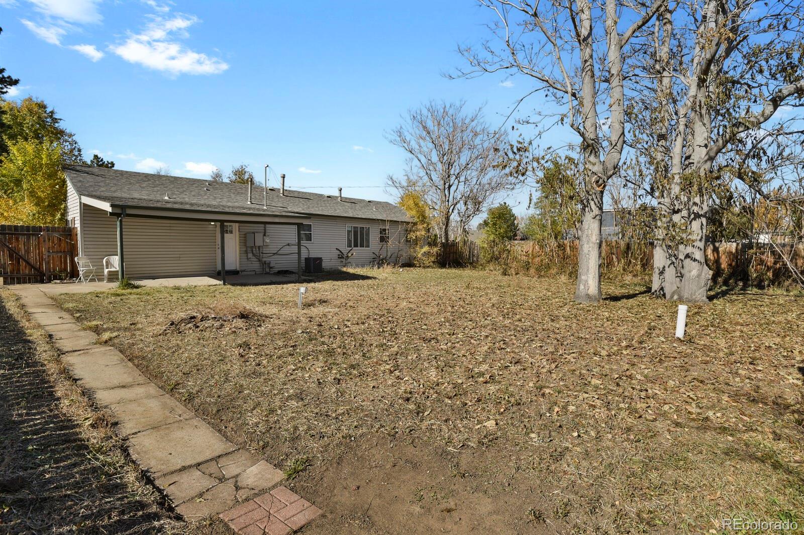 3720 Miller Street Wheat Ridge, CO 80033 - Photo 16 of 17 a view of house with a yard