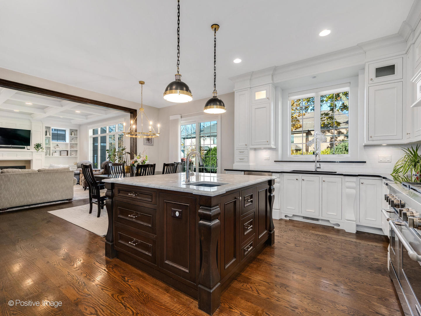 109 East Madison Street Elmhurst, IL 60126 - Photo 14 of 56 a kitchen with kitchen island granite countertop a sink a counter top space appliances and cabinets