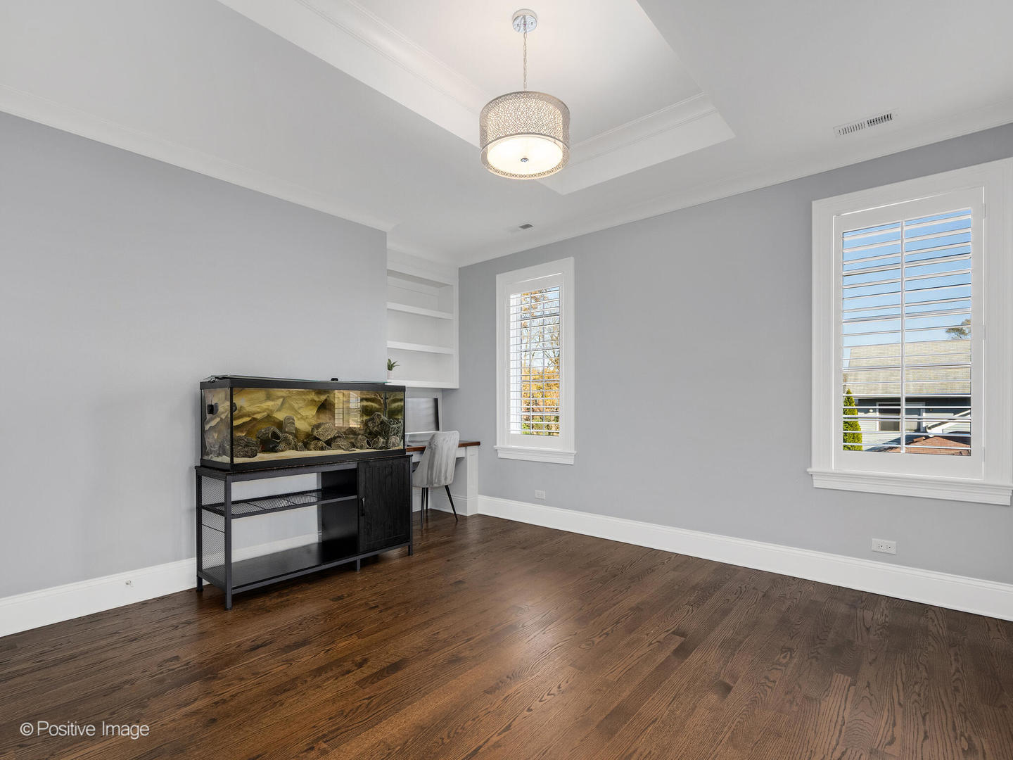 109 East Madison Street Elmhurst, IL 60126 - Photo 38 of 56 a kitchen with wooden floors and stainless steel appliances