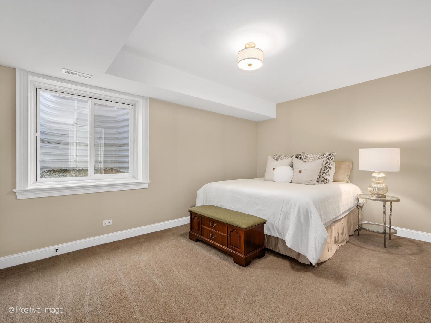 109 East Madison Street Elmhurst, IL 60126 - Photo 45 of 56 a spacious bedroom with a bed and a window