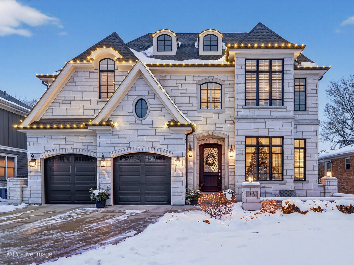 109 East Madison Street Elmhurst, IL 60126 - Photo 52 of 56 a front view of a house with yard and a garden