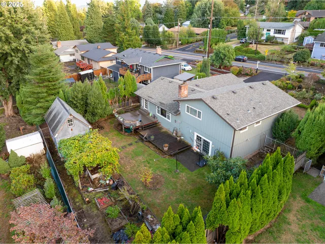 an aerial view of residential house with outdoor space and swimming pool