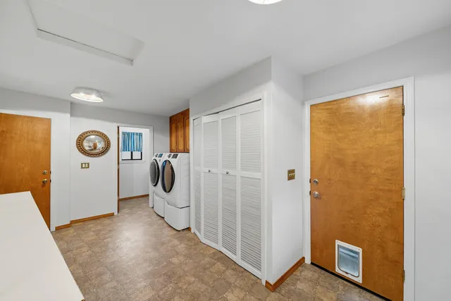 a view of a livingroom with a furniture and closet