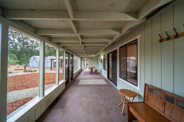 a view of a small house with wooden floor