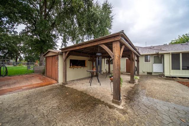 a building outdoor space with patio furniture and a potted plant