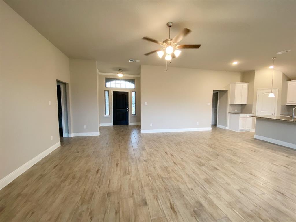 3101 Razorback Street Melissa, TX 75454 - Photo 24 of 40 a view of empty room with wooden floor and ceiling fan