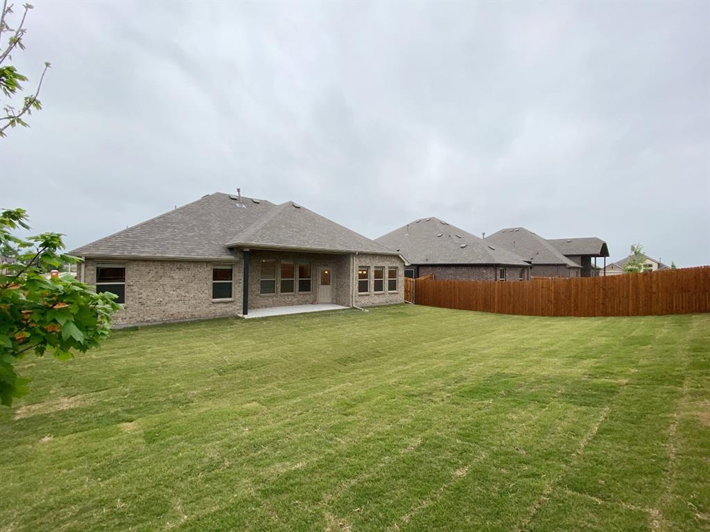 3101 Razorback Street Melissa, TX 75454 - Photo 31 of 40 a house with huge green field in front of it