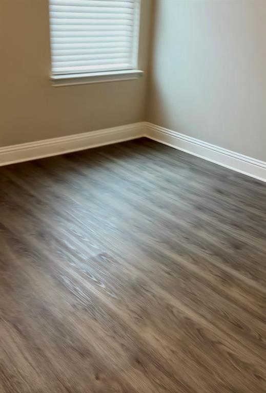 3101 Razorback Street Melissa, TX 75454 - Photo 38 of 40 a view of a room with wooden floor and a window