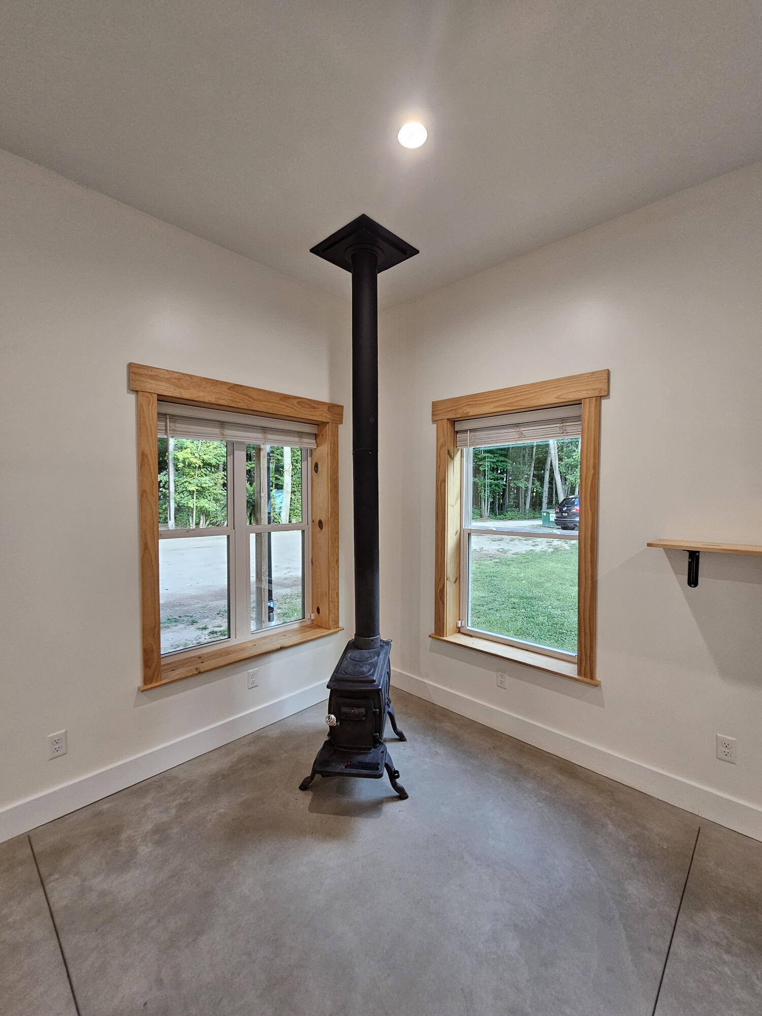 11122 Evergreen Road Gowen, MI 49326 - Photo 13 of 44 wood stove close up