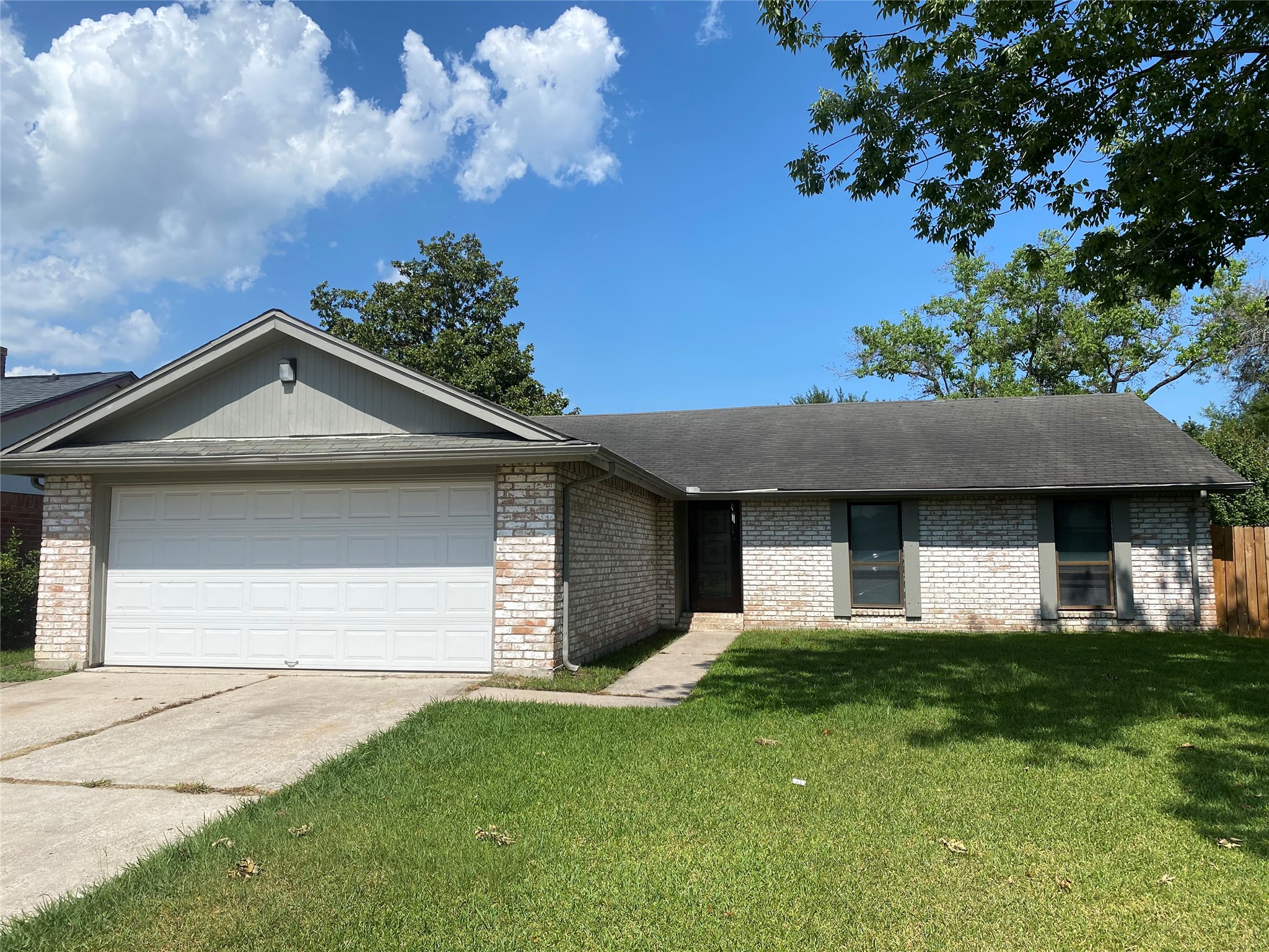 1330 Somercotes Lane Channelview, TX 77530 - Photo 1 of 13 a front view of a house with a yard and garage