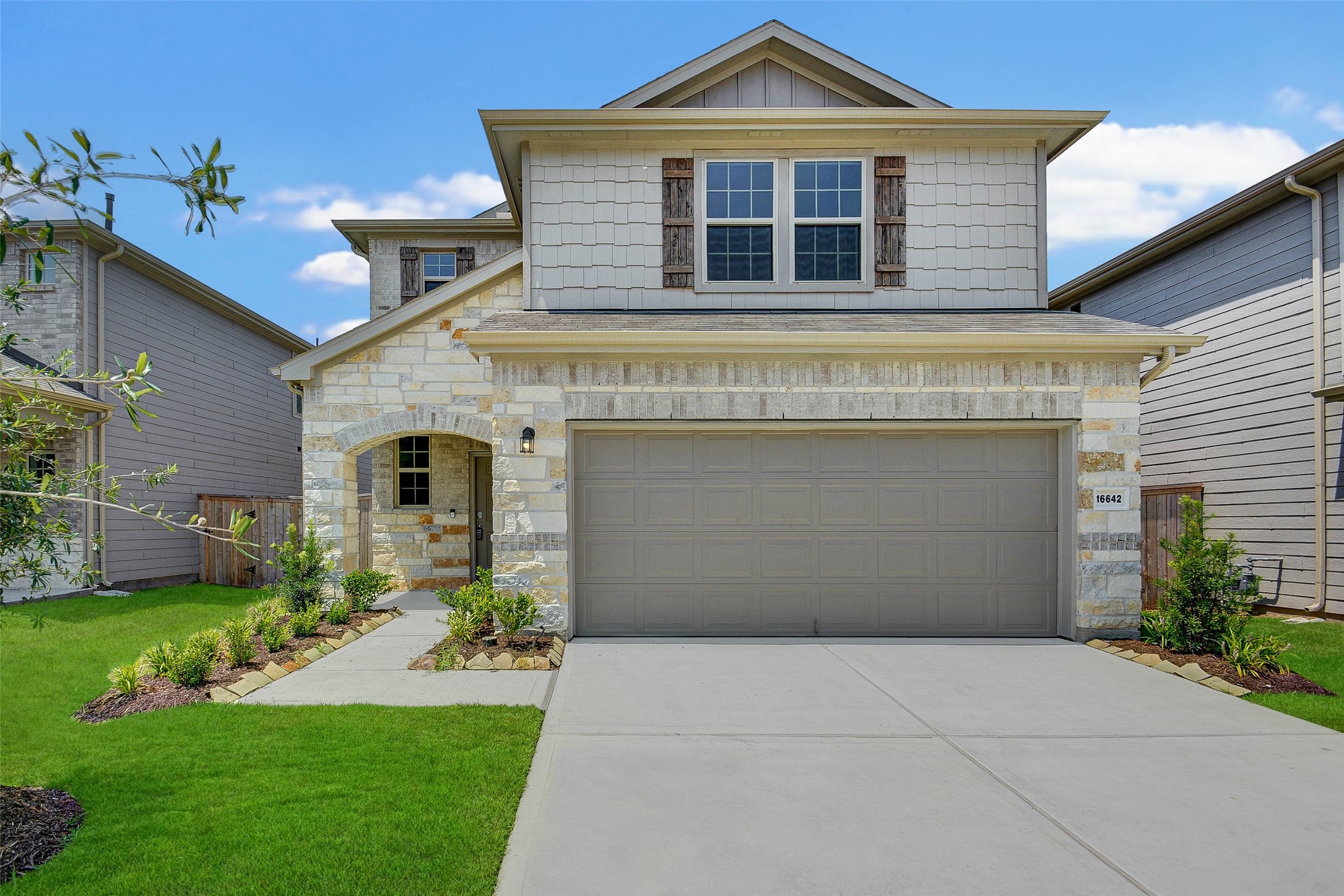 16642 Teak Mantle Road Conroe, TX 77302 - Photo 1 of 35 a front view of a house with garden
