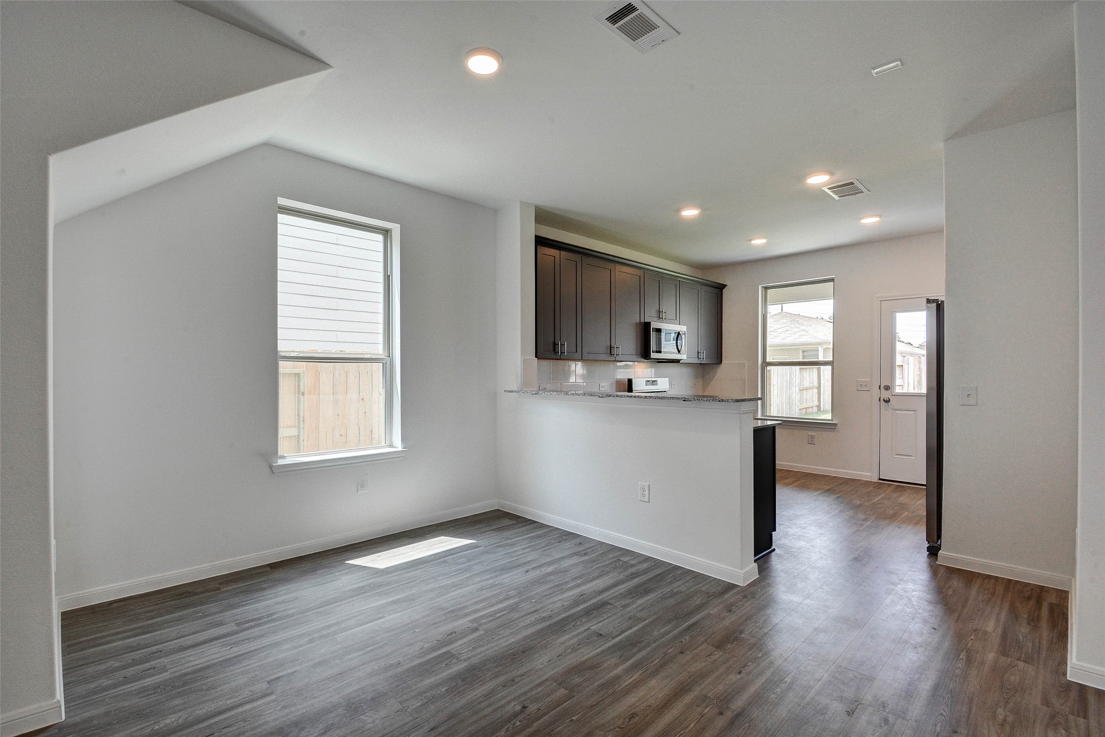 16642 Teak Mantle Road Conroe, TX 77302 - Photo 11 of 35 a view of a kitchen with a sink and a window