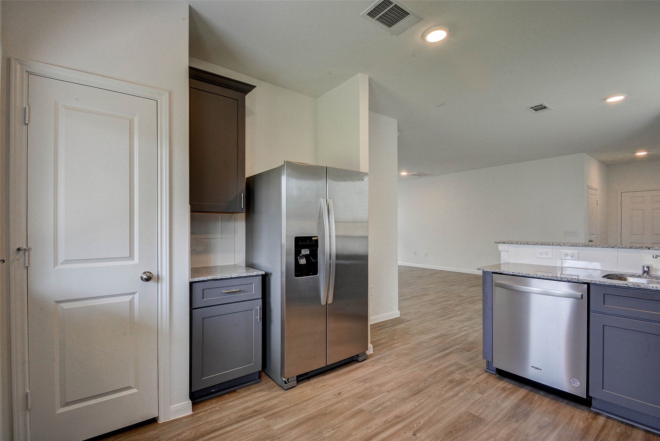 16642 Teak Mantle Road Conroe, TX 77302 - Photo 15 of 35 a kitchen with stainless steel appliances a refrigerator and a stove