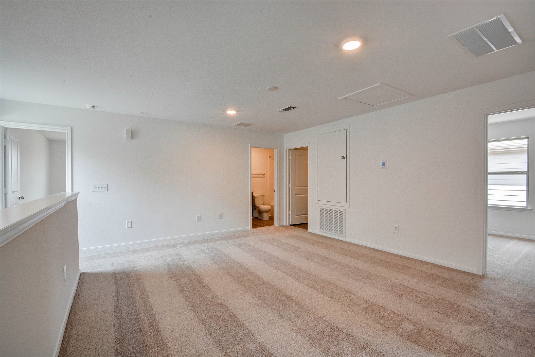 16642 Teak Mantle Road Conroe, TX 77302 - Photo 17 of 35 a view of an empty room with wooden floor
