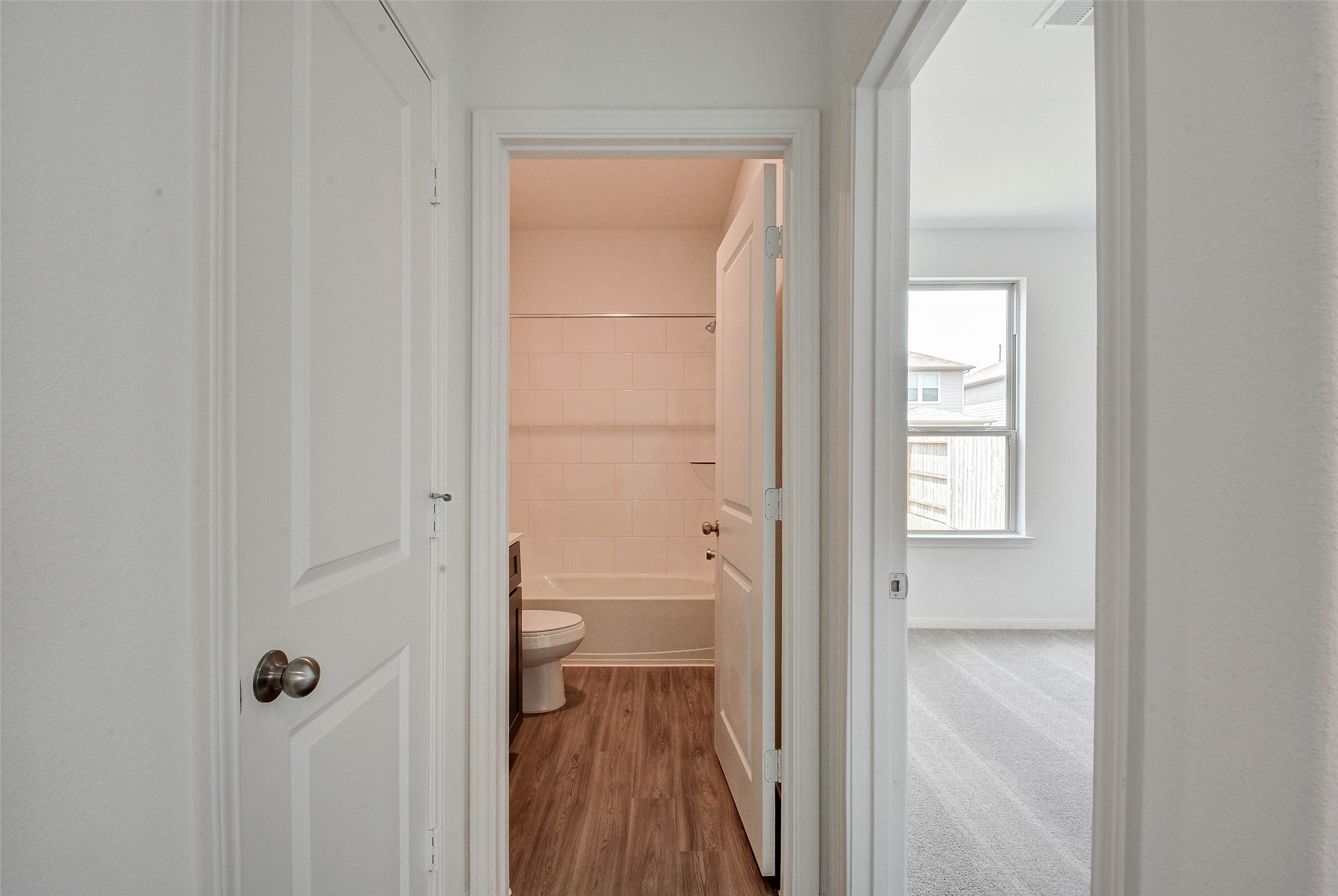16642 Teak Mantle Road Conroe, TX 77302 - Photo 19 of 35 a view of a bathroom from a hallway