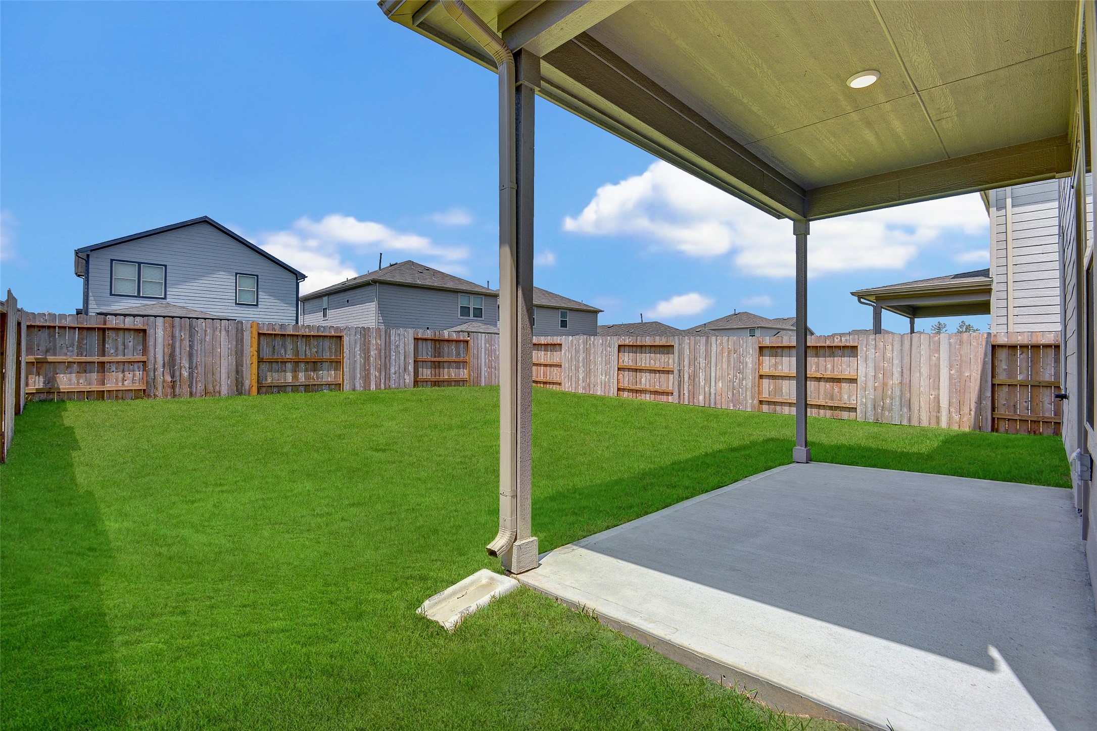 16642 Teak Mantle Road Conroe, TX 77302 - Photo 21 of 35 a view of a house with a yard
