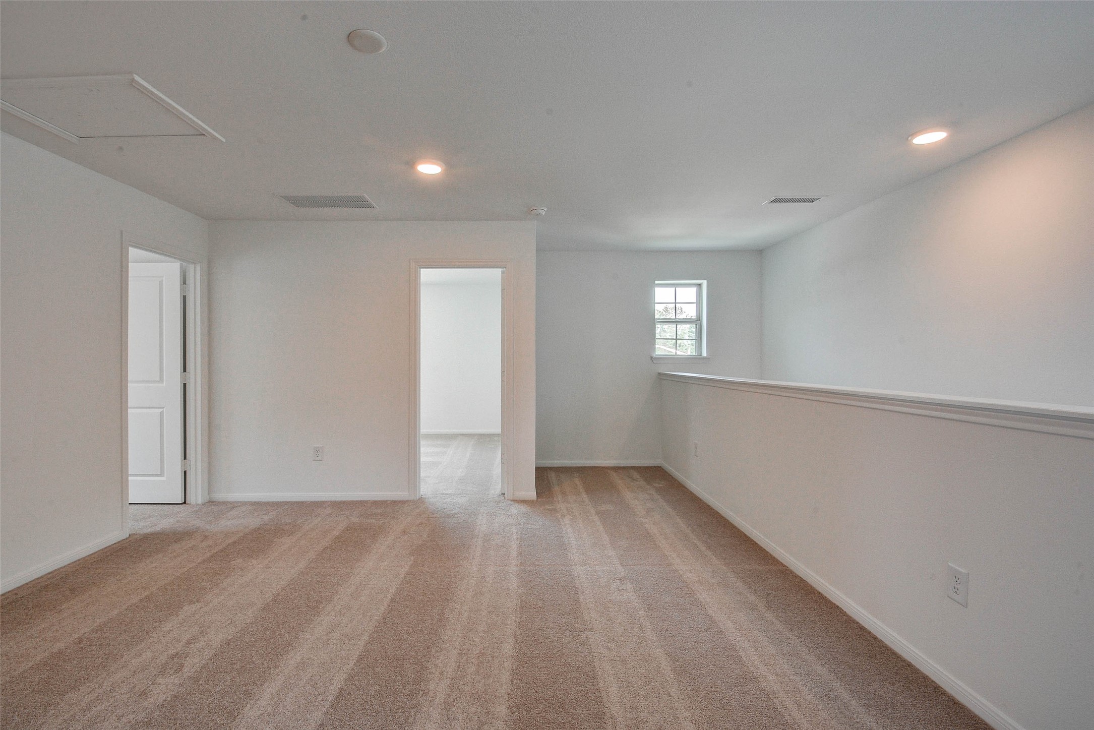 16642 Teak Mantle Road Conroe, TX 77302 - Photo 23 of 35 a view of wooden floor and windows in a room