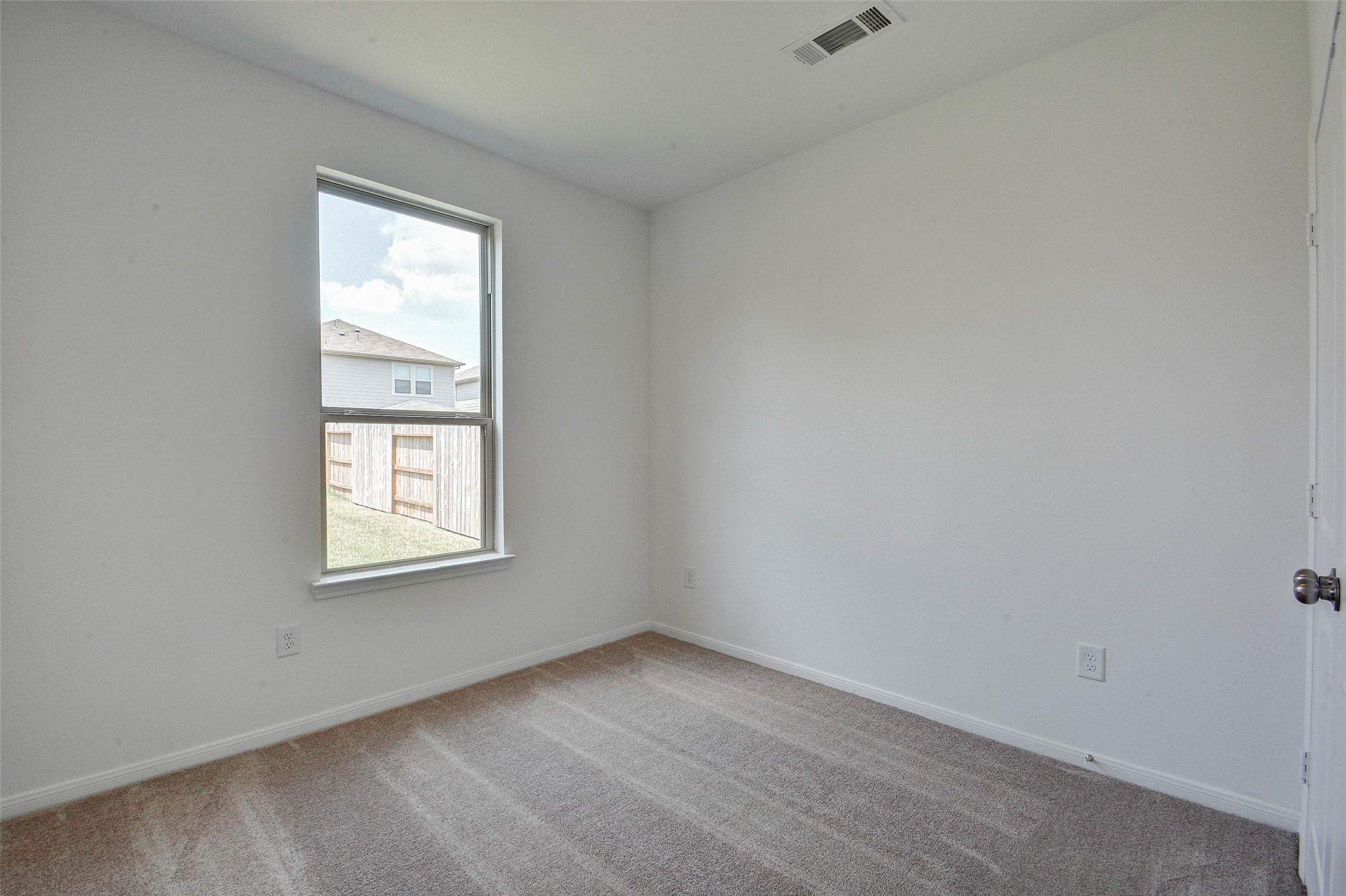 16642 Teak Mantle Road Conroe, TX 77302 - Photo 26 of 35 an empty room with a window