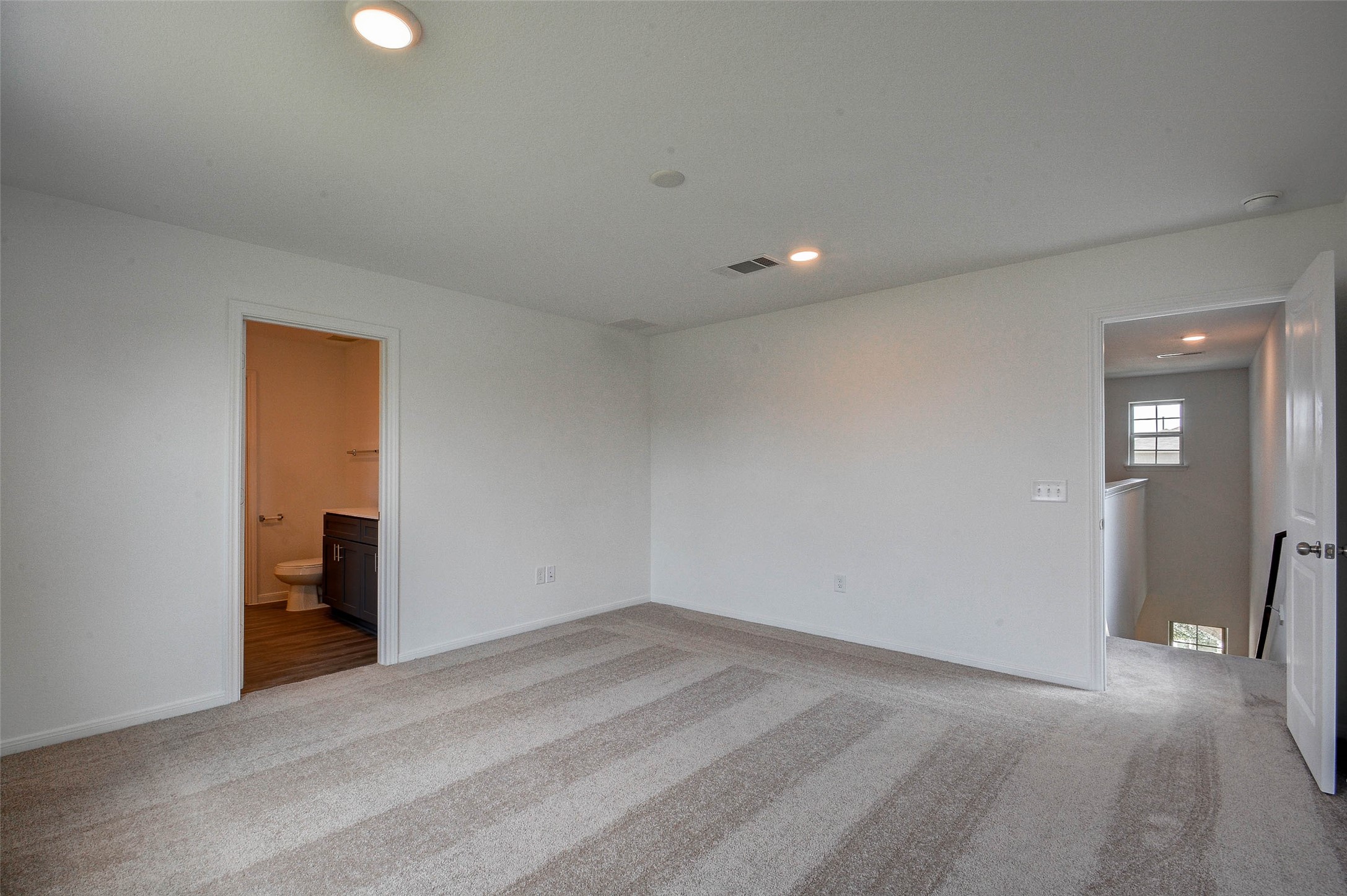 16642 Teak Mantle Road Conroe, TX 77302 - Photo 28 of 35 a view of a livingroom with wooden floor and staircase