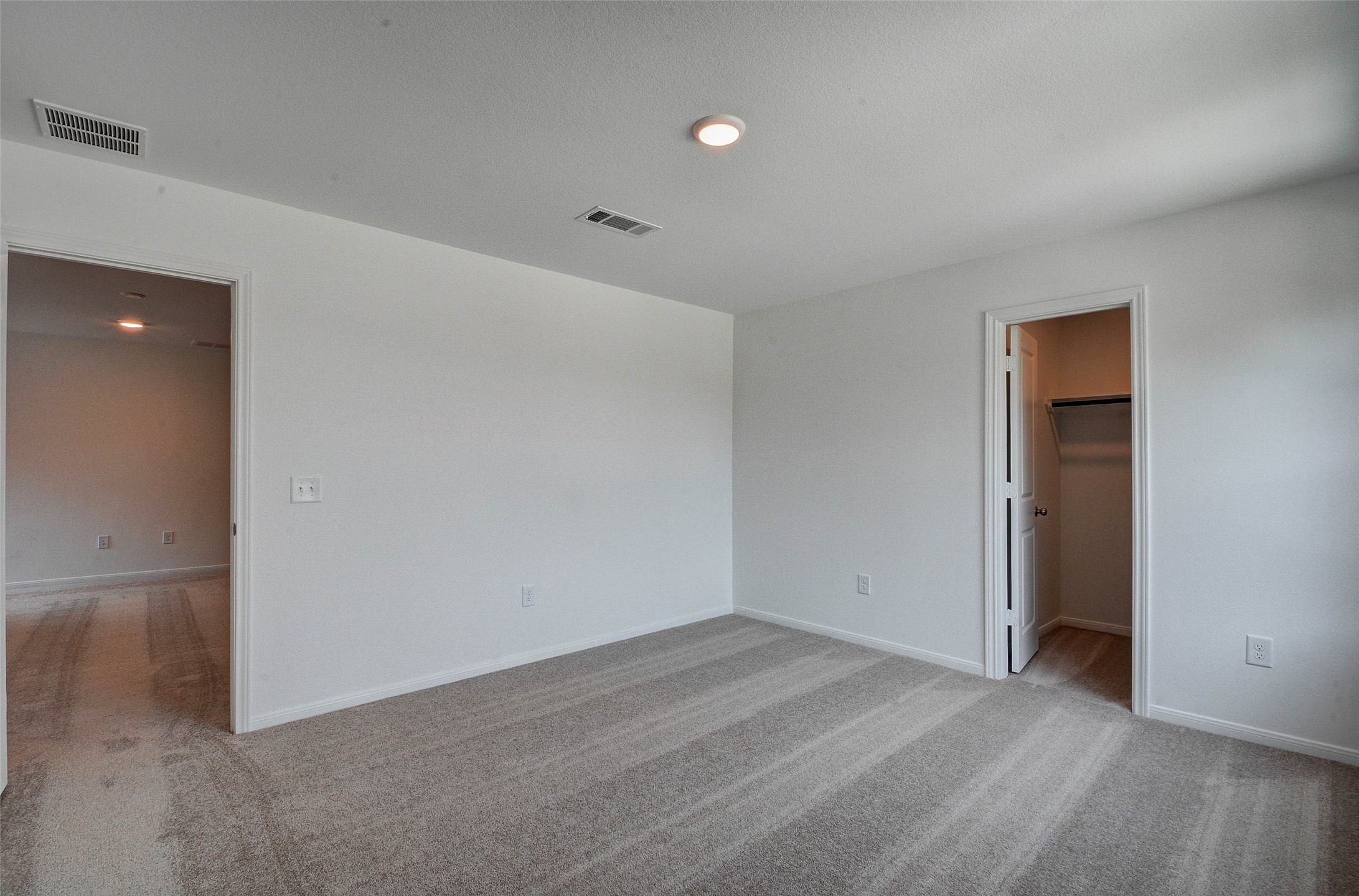 16642 Teak Mantle Road Conroe, TX 77302 - Photo 29 of 35 an empty room with wooden floor and windows